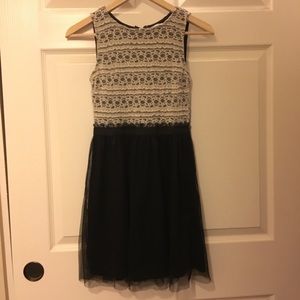 Cremé and black dress